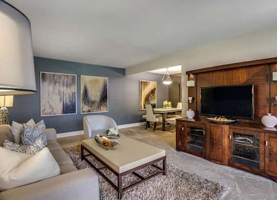 a living room with a fireplace and a television