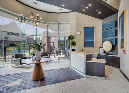 Leasing office with view of resort-style pool, grilling station, and fitness center