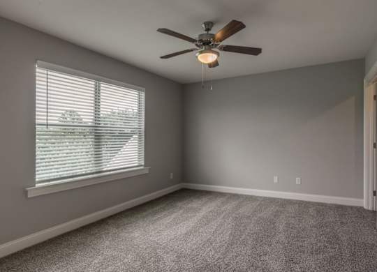 Bedroom with Large window at Mode at Melbourne, LLC Apartments, Melbourne, FL