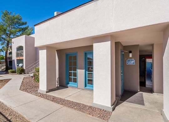 A building with a blue door and a sign that says