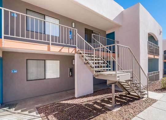 A building with a staircase leading to the second floor.