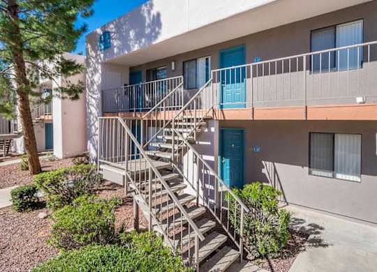 A building with a staircase leading to a balcony.
