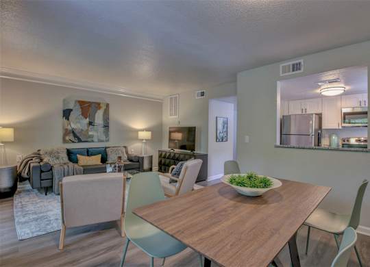 A dining room with a wooden table and chairs.