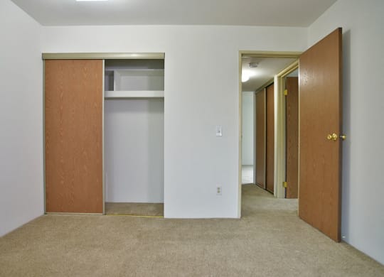 Master Bedroom with Large Closet at Charter Oaks Apartments, Davison, Michigan