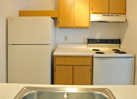 White Appliances in Kitchen at Charter Oaks Apartments, Davison, 48423