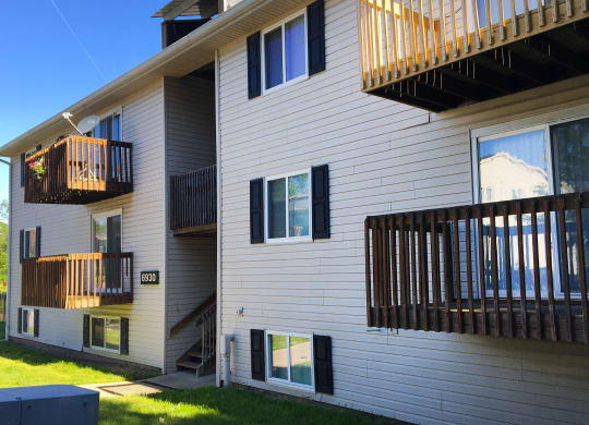 a view of the side of a house with two balconies at Oakwood Apartments, Florence, KY