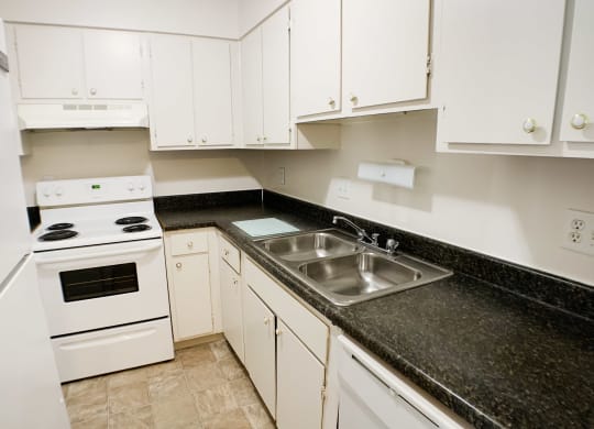 Kitchen with appliances at Oakwood Apartments, Florence, 41042