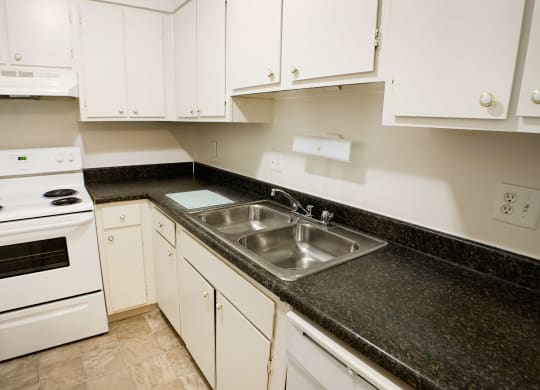 Kitchen with cabinets and appliances at Oakwood Apartments, Florence