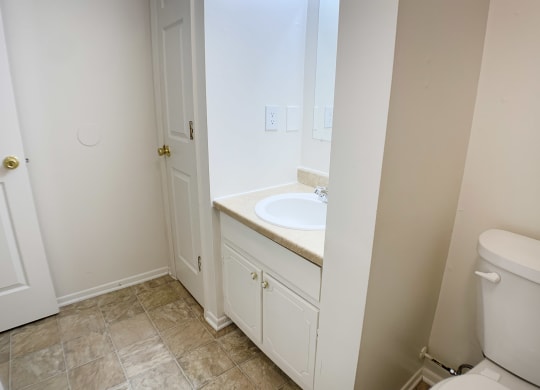 Bathroom with toilet at Oakwood Apartments, Florence