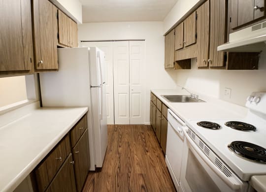 Kitchen Designed With Ample Storage Space  at Concord Woods Apartments, Milford