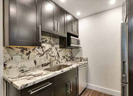 Glass Tiled Kitchen Backsplash at Woodcliff Apartments, Los Angeles, 90034