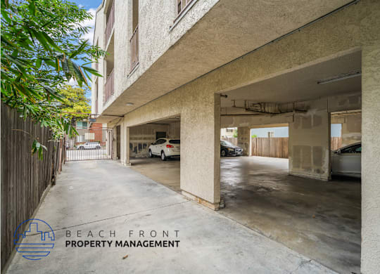 A parking garage with a car parked in the middle.