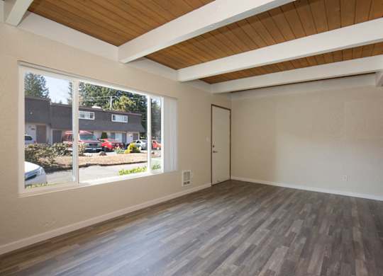 Living Space with Exposed Overhead Beams at Woodlake Townhomes, Edmonds, WA, 98026