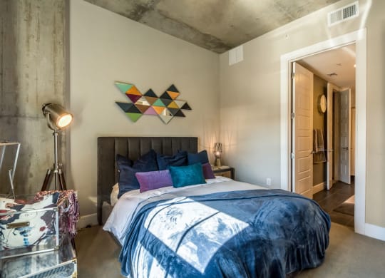 Industrial-inspired bedroom with queen sized bed