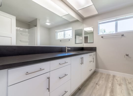 Renovated Bathrooms With Quartz Counters at Bixby Hill Apartments, California