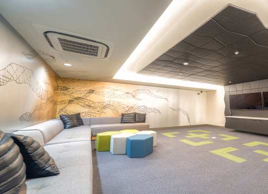 Theatre room with large TV's with large couch seating