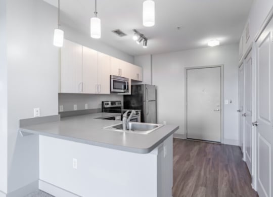 Kitchen with cabinets and white interior at Canalside, Augusta, Georgia