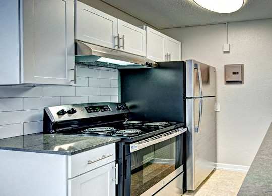 White Kitchen with Stainless Steel  at Lock Vista, Seattle, 98107