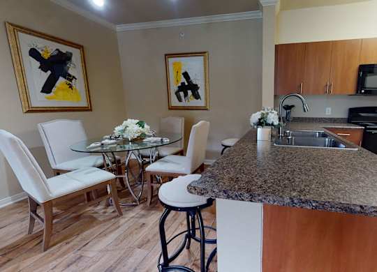 Kitchen and dining area at Lakeland Estates Apartments in Stafford TX