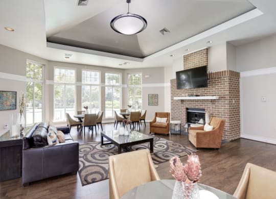 a living room with a fireplace and a large window