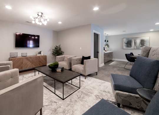 TV room with seating at Governor Square Apartments, Carmel, IN