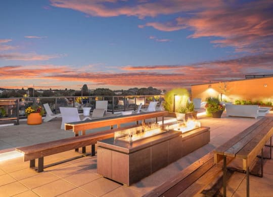 The Wilmore rooftop patio with table and chairs