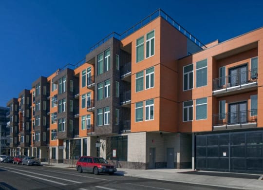 The Wilmore exterior rendering with a car on the street