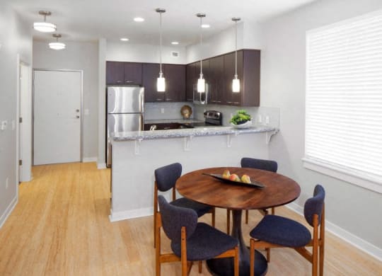 The Wilmore dining room and kitchen with table and chairs