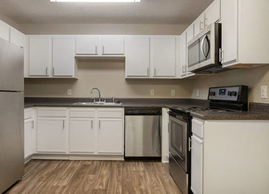 Spacious Kitchen with Pantry Cabinet at Ridgeland Place Apartment Homes, Ridgeland, MS, 39157