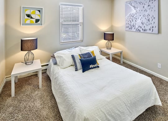 Carpeted bedroom to fit a queen sized bed and two side tables. One window over the bed.at Woodhaven, Everett, WA