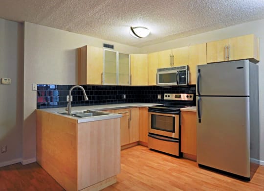 kitchen with brown cabinets and silver appliances