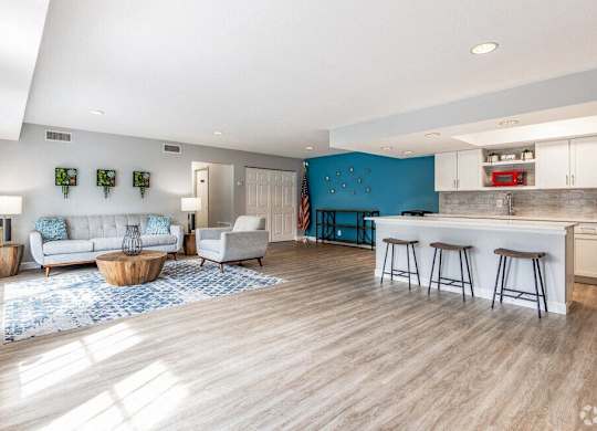 a living room with a kitchen and a couch