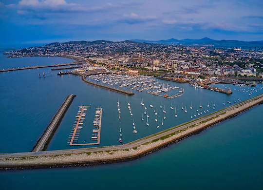 A marina with boats docked in the water and a city in the background. at Cherrywood Apartments, D18 VY3V, DUBLIN 18