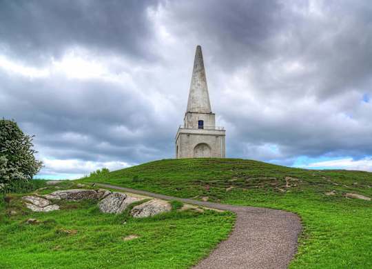 A tall monument stands on a grassy hill with a cloudy sky above. at Cherrywood Apartments, D18 VY3V, DUBLIN 18