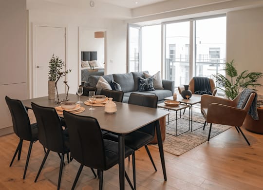 A modern dining room with a large table and chairs. at Cherrywood Apartments, D18 VY3V, DUBLIN 18