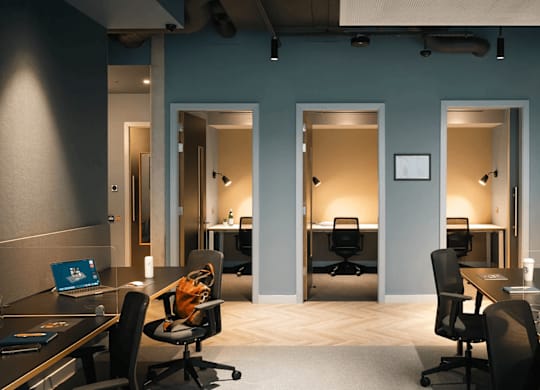 A modern office space with desks, chairs, and computers. at Cherrywood Apartments, D18 VY3V