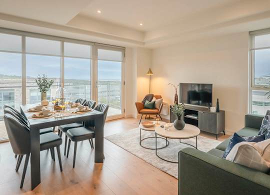 A modern living room with a dining table and a couch at Cherrywood Apartments, D18 VY3V, DUBLIN 18