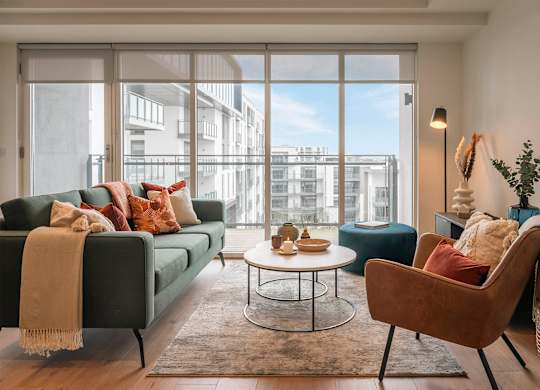 A living room with a couch, chair, and coffee table at Cherrywood Apartments, D18 VY3V, DUBLIN 18