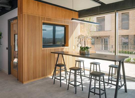 A room with a wooden wall and a television on it at Cherrywood Apartments, D18 VY3V, DUBLIN 18
