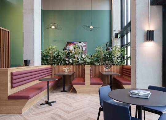 A modern dining area with a round table and chairs at Cherrywood Apartments, D18 VY3V