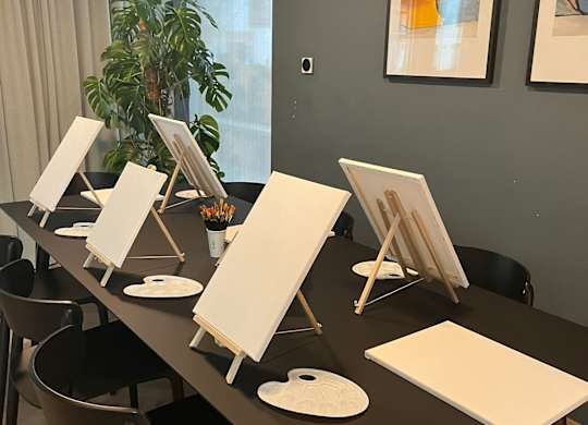 A room with a long table and chairs, and some artwork on the wall at Cherrywood Apartments, D18 VY3V