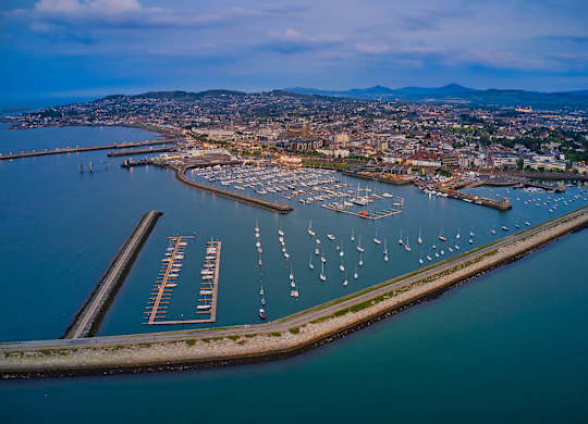 A marina with boats docked in the water and a city in the background at Cherrywood Apartments, D18 VY3V, DUBLIN 18