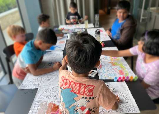 A group of children are sitting around a table drawing at Cherrywood Apartments, D18 VY3V, DUBLIN 18