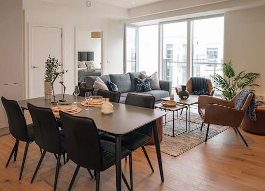 A modern dining room with a large table and chairs at Cherrywood Apartments, D18 VY3V, DUBLIN 18
