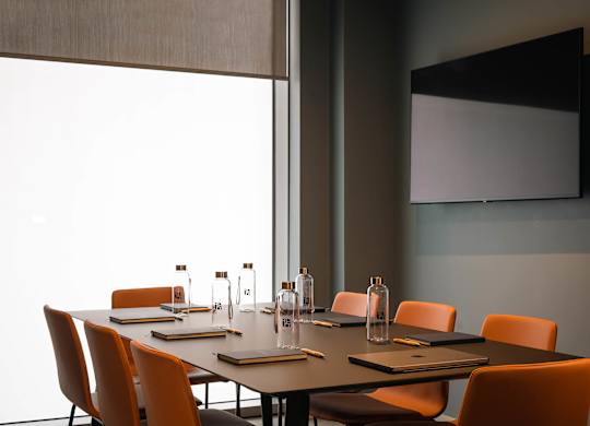A conference room with a long table and chairs at Cherrywood Apartments, D18 VY3V