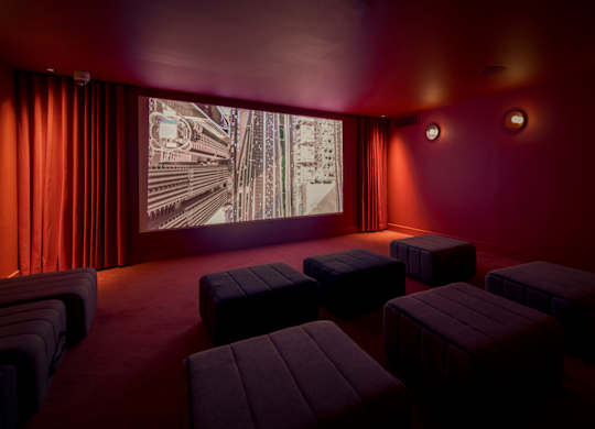Cinema room with red curtains at The Lark, London