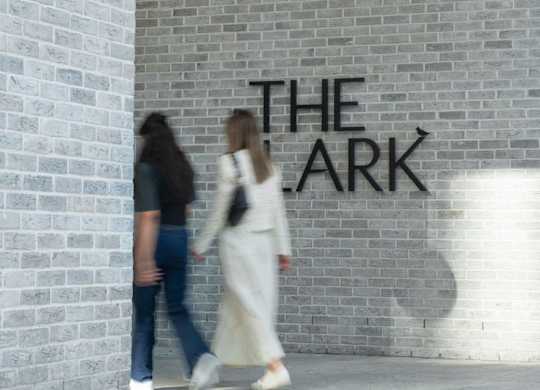 Two people walking towards property entrance at The Lark, London, SW11 7EA