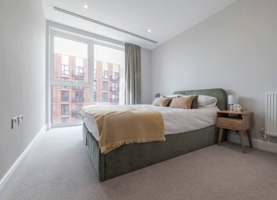 Bedroom with oversized window at The Lark, London, SW11 7EA