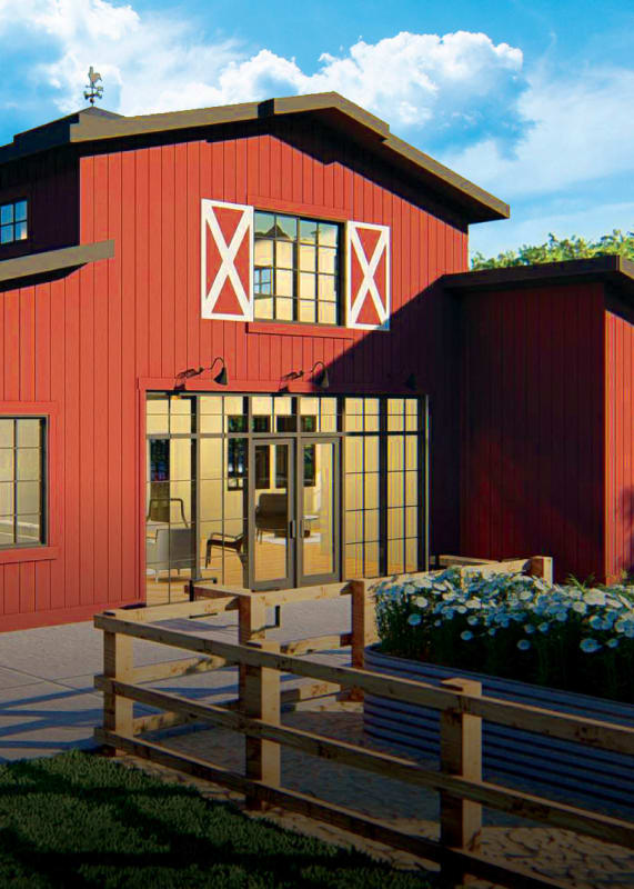 a red barn with a patio in front of it