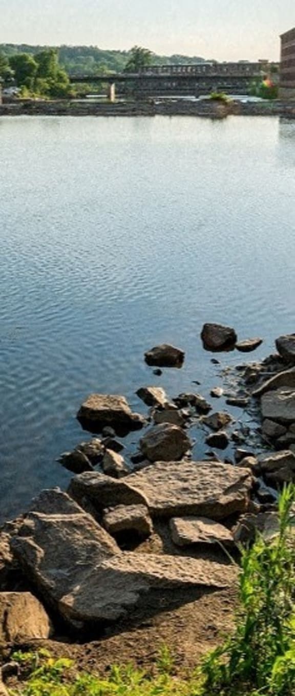 a large body of water with rocks in it